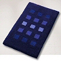 dense high pile contemporary rug with a geometric block pattern in eggplant, slate grey, dark blue or wine red