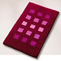 dense high pile contemporary rug with a geometric block pattern in eggplant, slate grey, dark blue or wine red