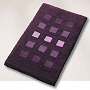 dense high pile contemporary rug with a geometric block pattern in eggplant, slate grey, dark blue or wine red